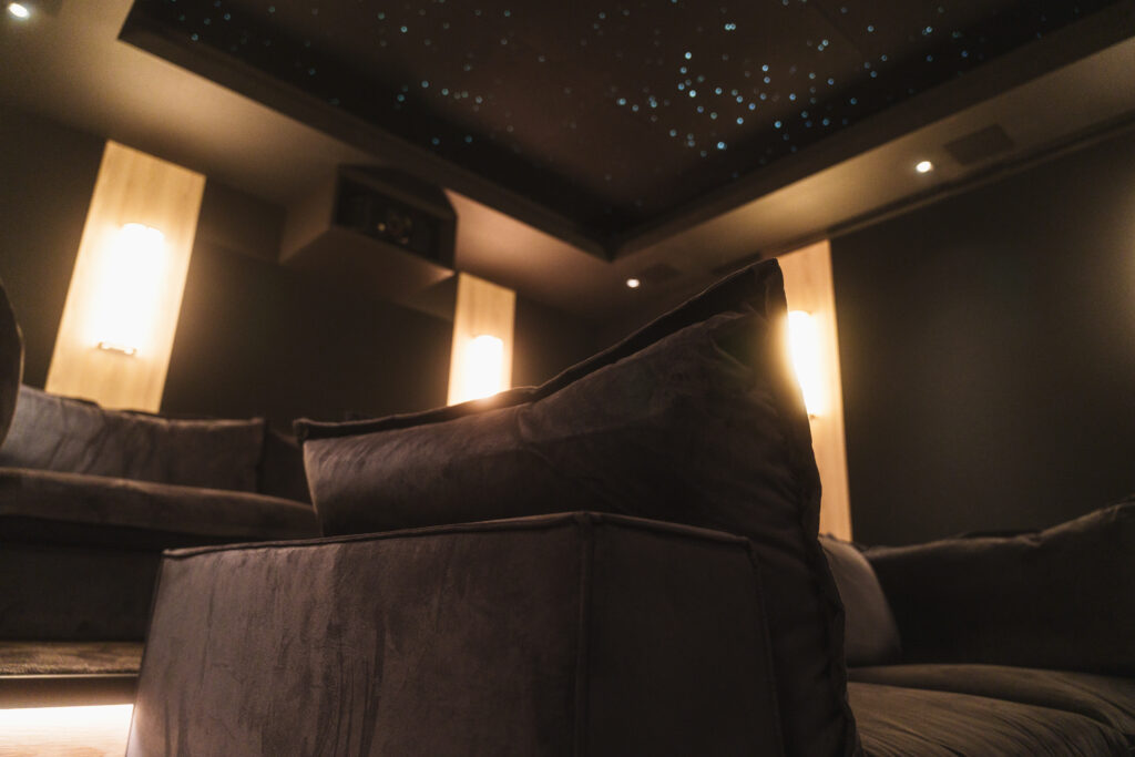 Tilal Al Ghaf home cinema with reclining theatre seating and starlight ceiling